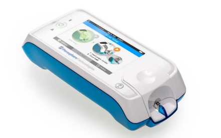 Figure 2. Image of ClotChek® instrument and schematic of ClotChek cuvette and IR imaging system.
